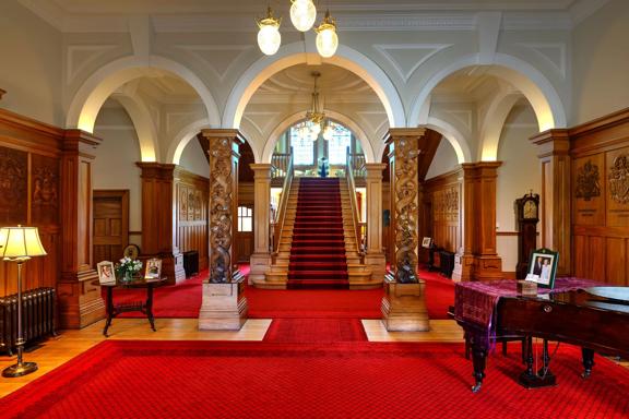 The red and white interior of the Government House in Wellington.