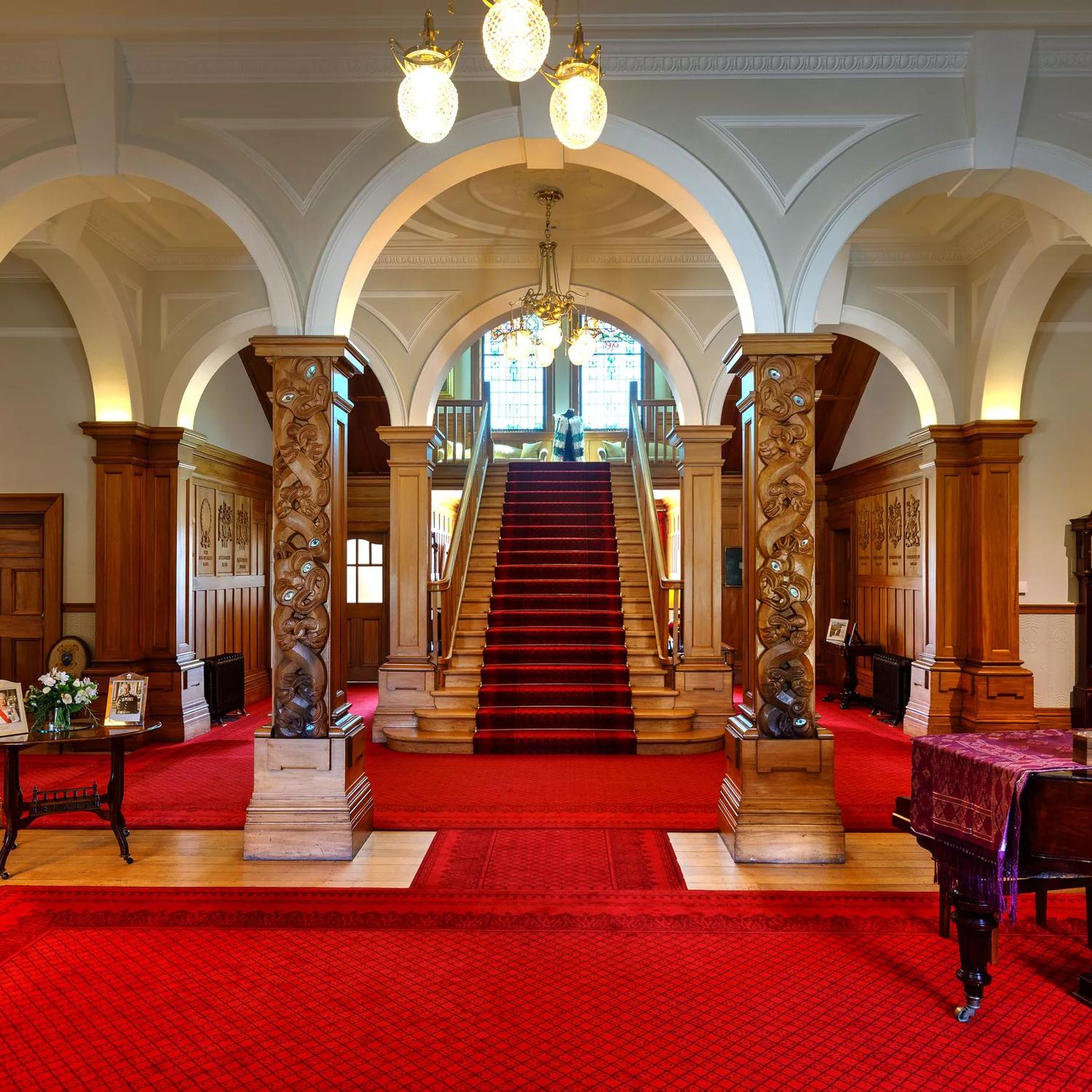 The red and white interior of the Government House in Wellington.