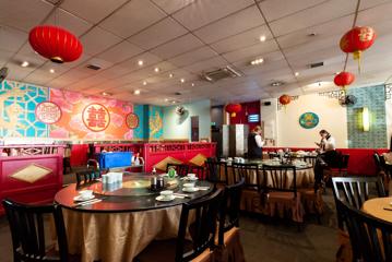 Interior of Dragons restaurant, with chinese cultural items around the room.