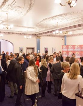 A large gathering of people at a private function inside The Opera House.