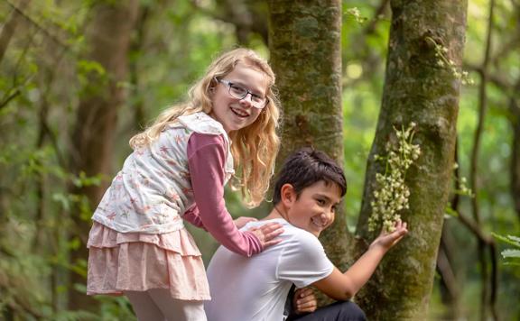 Two children at looking at plants on the Kohekohe Walk at Hemi Matenga Scenic Reserve in Waikenae.