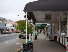 The screen location of Greytown, a historic small town featuring Victorian buildings,  stables, colonial cottages, and rural landscapes surrounding.
