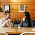 Two people enjoy a flight of coffee at The Hangar.