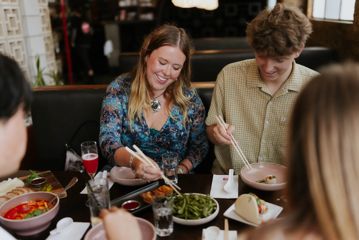 Four friends enjoy Asian fusion dishes at Chow in Wellington.