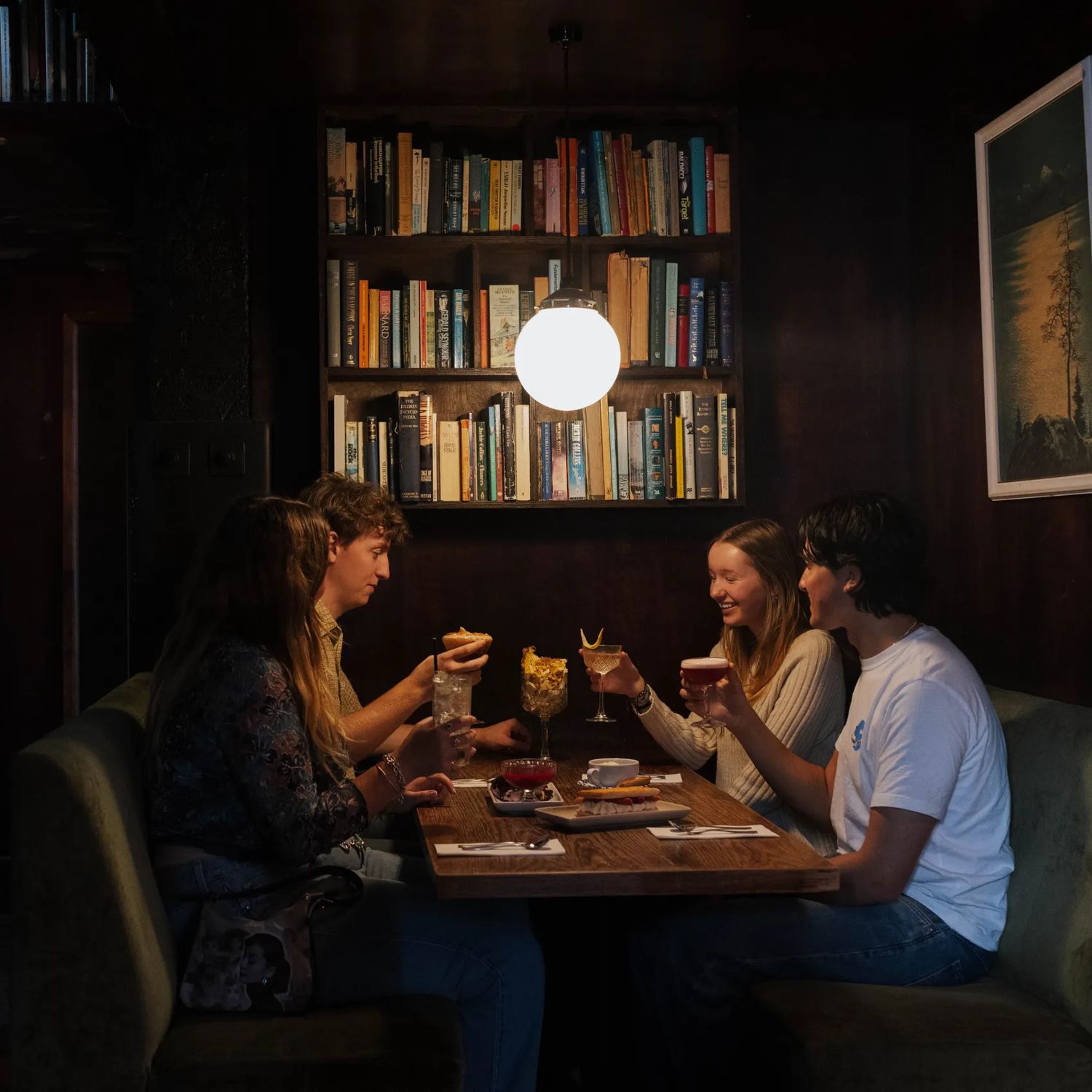 Diners gather in a cosy booth at The Library bar on Courtenay Place in Wellington.