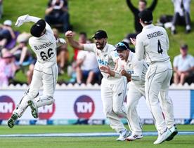 New Zealand wicketkeeper Tom Blundell celebrates after taking a catch to dismiss Ben Duckett of England during a test match.