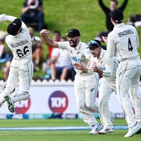 New Zealand wicketkeeper Tom Blundell celebrates after taking a catch to dismiss Ben Duckett of England during a test match.