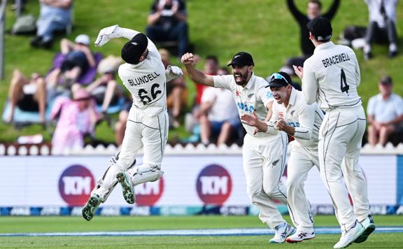 New Zealand wicketkeeper Tom Blundell celebrates after taking a catch to dismiss Ben Duckett of England during a test match.