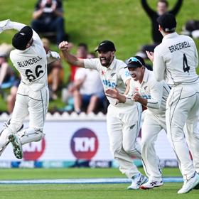 New Zealand wicketkeeper Tom Blundell celebrates after taking a catch to dismiss Ben Duckett of England during a test match.