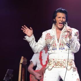 An impersonator pays homage to Elvis in the 'Elvis: An American Trilogy' show.