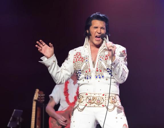 An impersonator pays homage to Elvis in the 'Elvis: An American Trilogy' show.