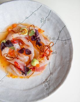 Close up of an orange raw fish dish served at Ortega Fish Shack.