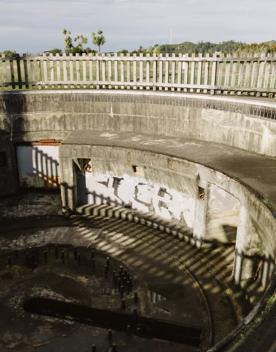 Gun Emplacement No.1 at Wrights Hill Fortress. It's a sunken circular area with a wooden fence around it. 