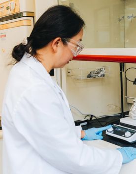 A scientist works in a lab.