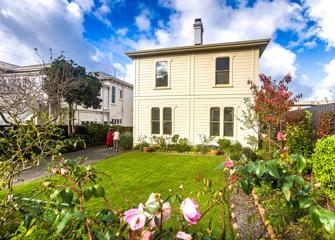 The exterior of Katherine Mansfield House & Garden. It is a small Victorian-style house with a well-manicured garden.