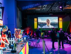 The bar set up of the fifa fan festival with purple lighting.