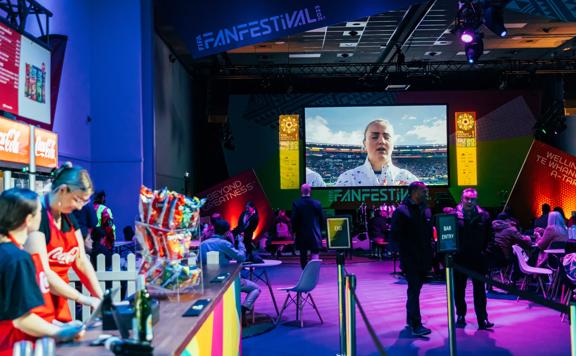 The bar set up of the fifa fan festival with purple lighting.