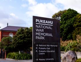 A sign at Pukeahu National War Memorial Park showing directions around the area.
