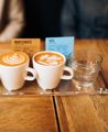 A flight of coffee and a glass of water.
