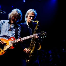 A photo of The Dire Straits Experience performing on stage at The Opera House, Wellington