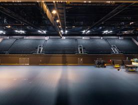 the large open space inside TSB arena before any set up is done, showing off the size of the room and how much seating it can hold.