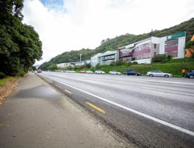 The urban setting of the Hutt Road Ngauranga Interchange, where highways got over tunnels with walls that once had graffiti.