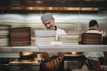 A chef working in the kitchen at Hei Chinese restaurant.