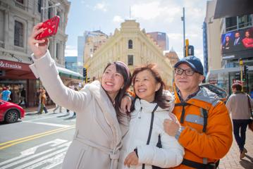 3 people taking a selfie outside The Old Bank Arcade.