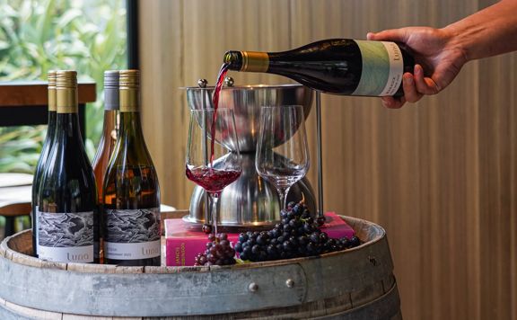 Pouring a glass of red wine at Luna Estate