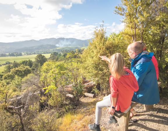 A family points at the view from Fensham Reserve in Wairarapa.