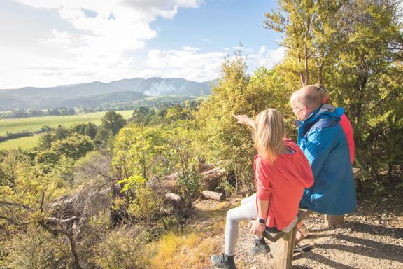 A family points at the view from Fensham Reserve in Wairarapa.