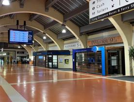 Interior of Wellington train station, an open space, with curved arches.