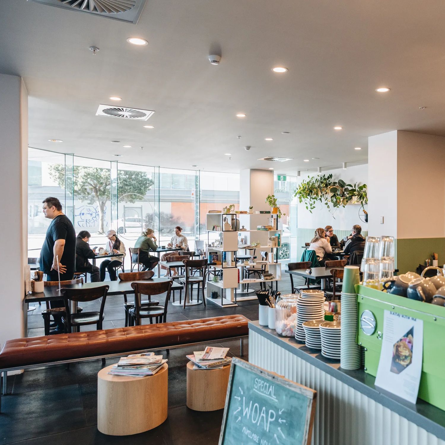 Kākāriki Coffee interior showing coffee machine and cafe tables