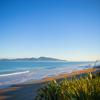 The beach at Queen Elizabeth Regional Park in the Kāpiti Coast with a view of Kapiti Island.