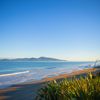 The beach at Queen Elizabeth Regional Park in the Kāpiti Coast with a view of Kapiti Island.