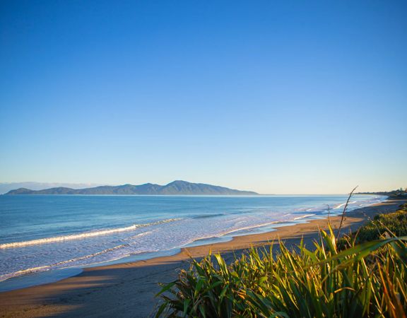 The beach at Queen Elizabeth Regional Park in the Kāpiti Coast with a view of Kapiti Island.