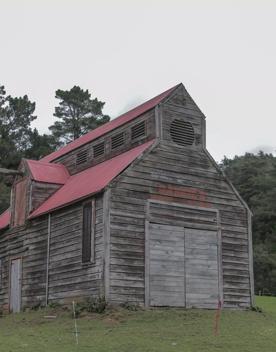 The screen location of Whiitemans Valley, nestled among trees and hills, old buildings have been built to mimic an old town.