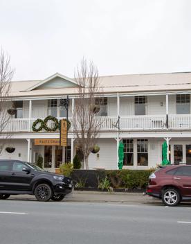 The screen location of Greytown, a historic small town featuring Victorian buildings,  stables, colonial cottages, and rural landscapes surrounding.