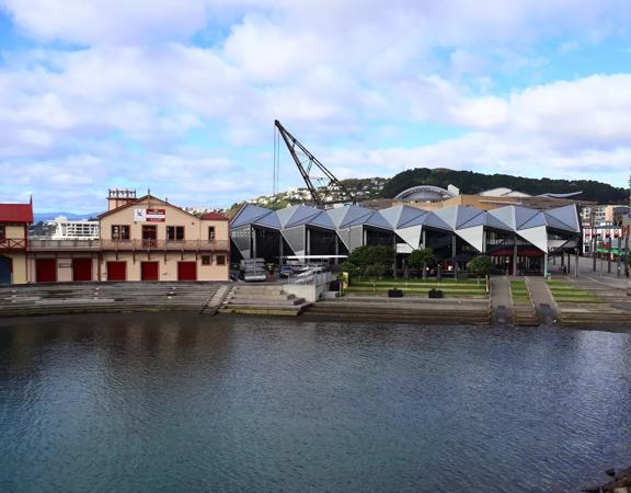 The Wellington Rowing Club, a modern geometric building made of metal and glass located at Whairepo Lagoon on Wellington's Waterfront.