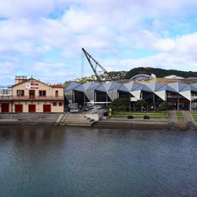 The Wellington Rowing Club, a modern geometric building made of metal and glass located at Whairepo Lagoon on Wellington's Waterfront. 