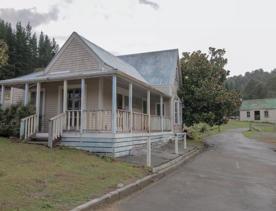 The screen location of Whiitemans Valley, nestled among trees and hills, old buildings have been built to mimic an old town.