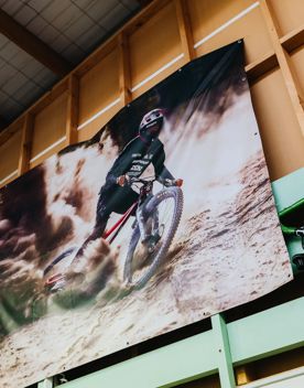 Poster on a wall showing a person riding a mountain bike