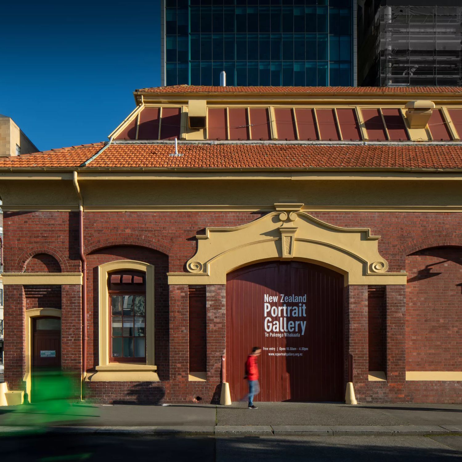 Exterior of the New Zealand Portrait Gallery in Wellington, housed in the historic brick Shed 11 building on the waterfront.
