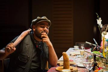 Director Aditya B. Parige on the set of the 'Diverse Voices' filming, holding a large stick.