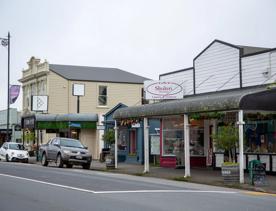 The screen location of Greytown, a historic small town featuring Victorian buildings,  stables, colonial cottages, and rural landscapes surrounding.