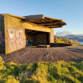 The screen location of West Wind Farm and Mākara Bunker at sunset, with 360 views of Wellington and the wind farm, as well as the historic fort Opau.