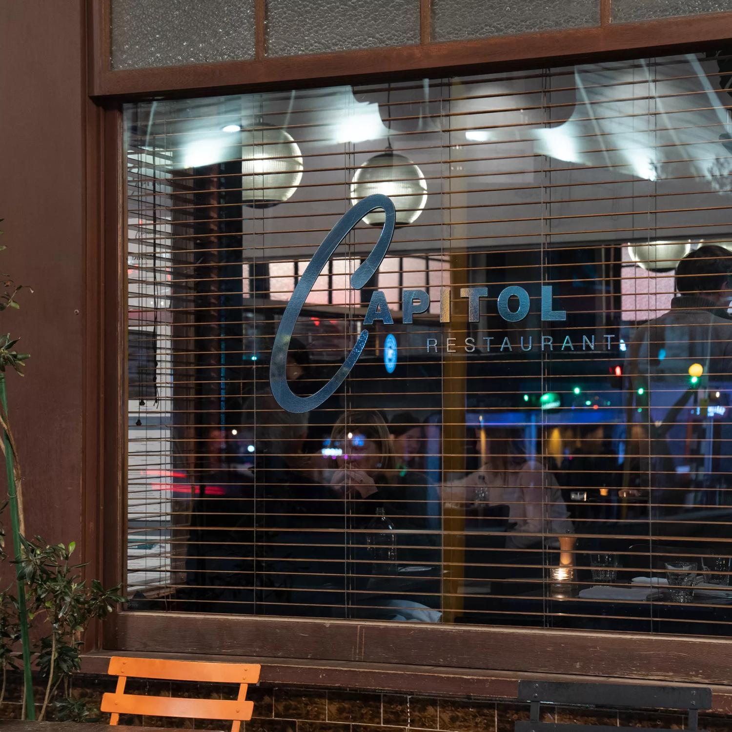 Exterior image looking through window into Capitol restaurant.