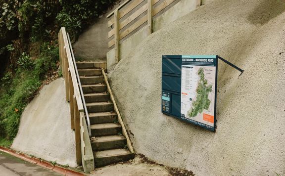 The MacKenzie Road Track in East Harbour Regional Park zigzags through regenerating bush with views of the harbour.