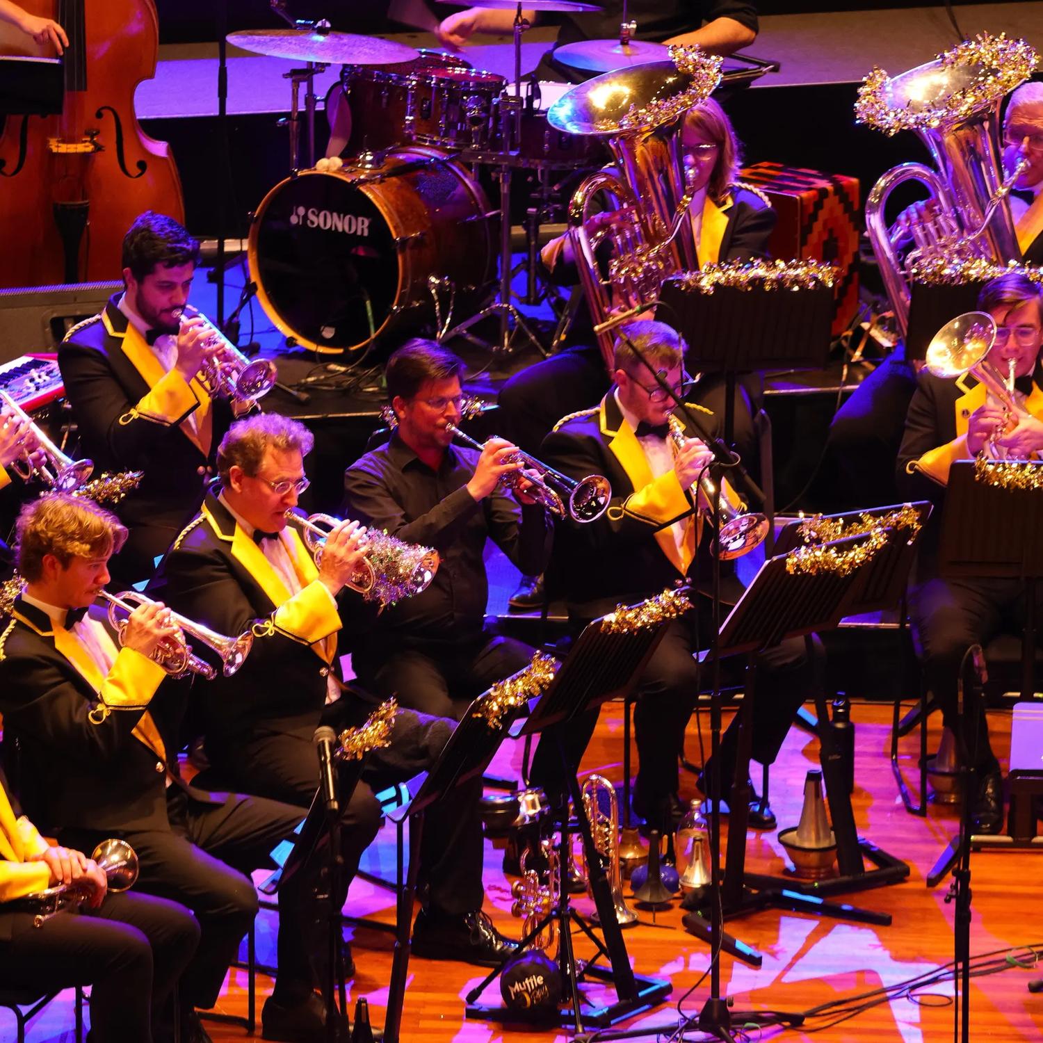 Brass band playing on stage.