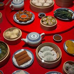 Knitted yum cha banquet items on a table.